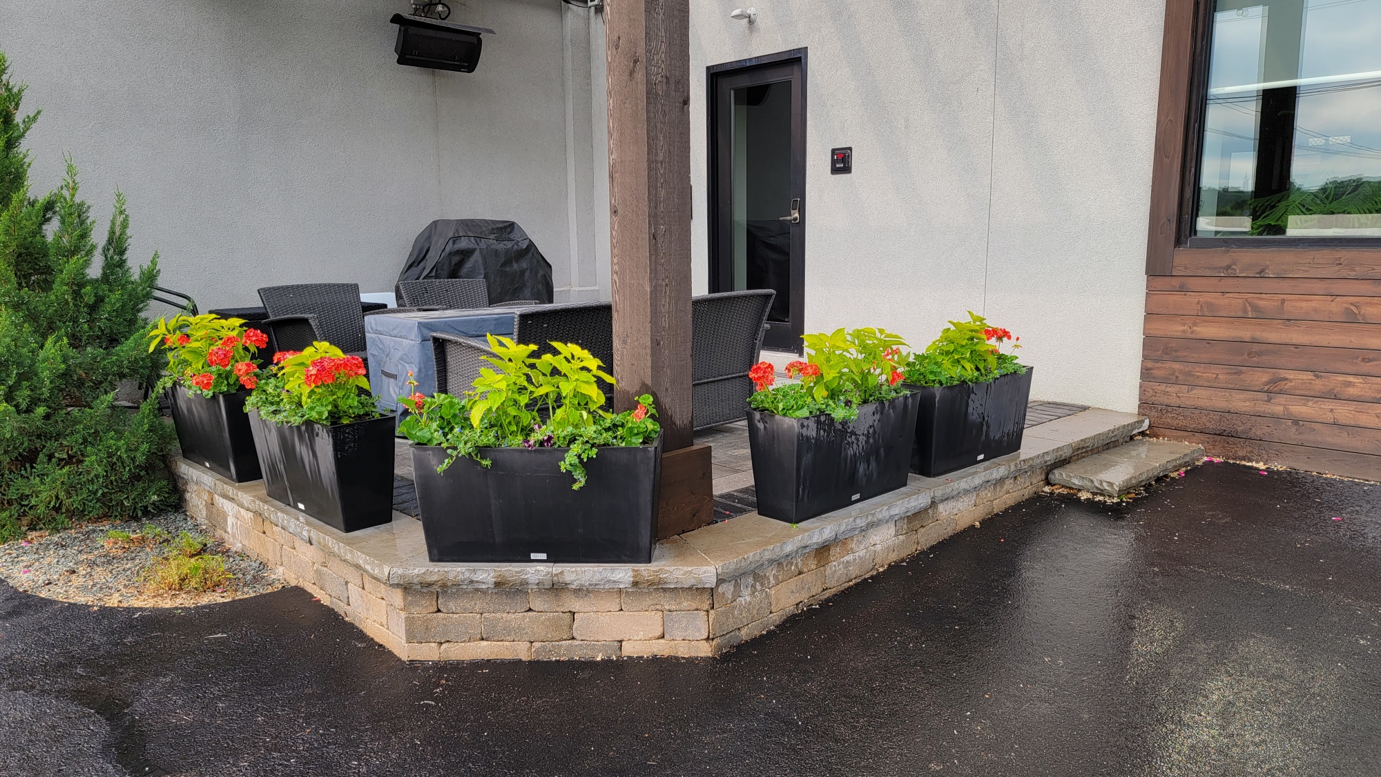 Commercial office patio with annuals in flower pots, St. Charles, IL — B&L Landscape