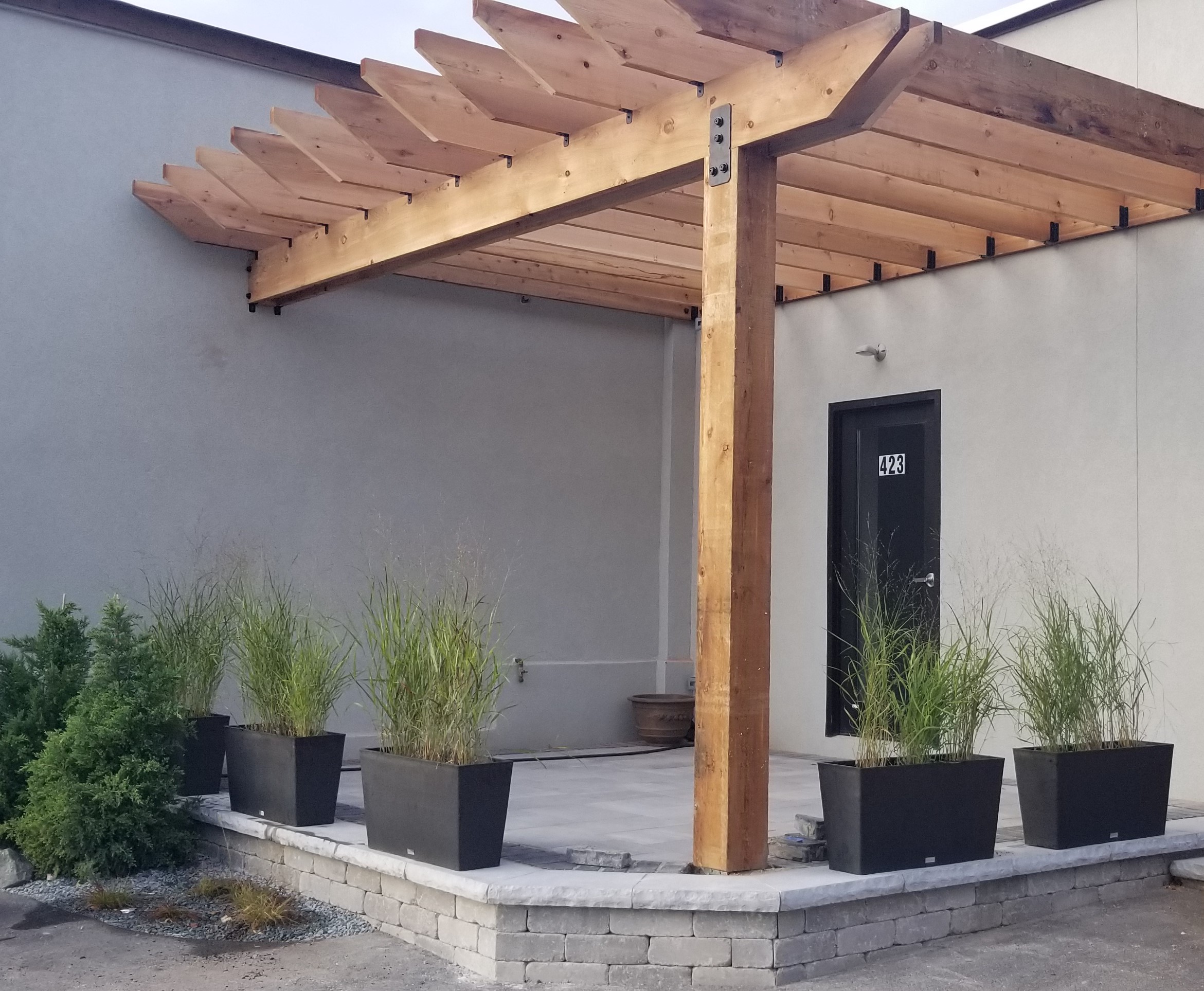 Commercial patio with pergola — B&L Landscape hardscape