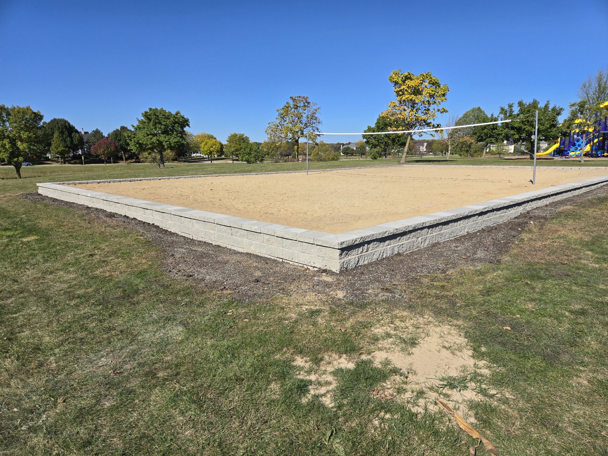 Sand volleyball court retaining wall, West Chicago, IL — B&L Landscape