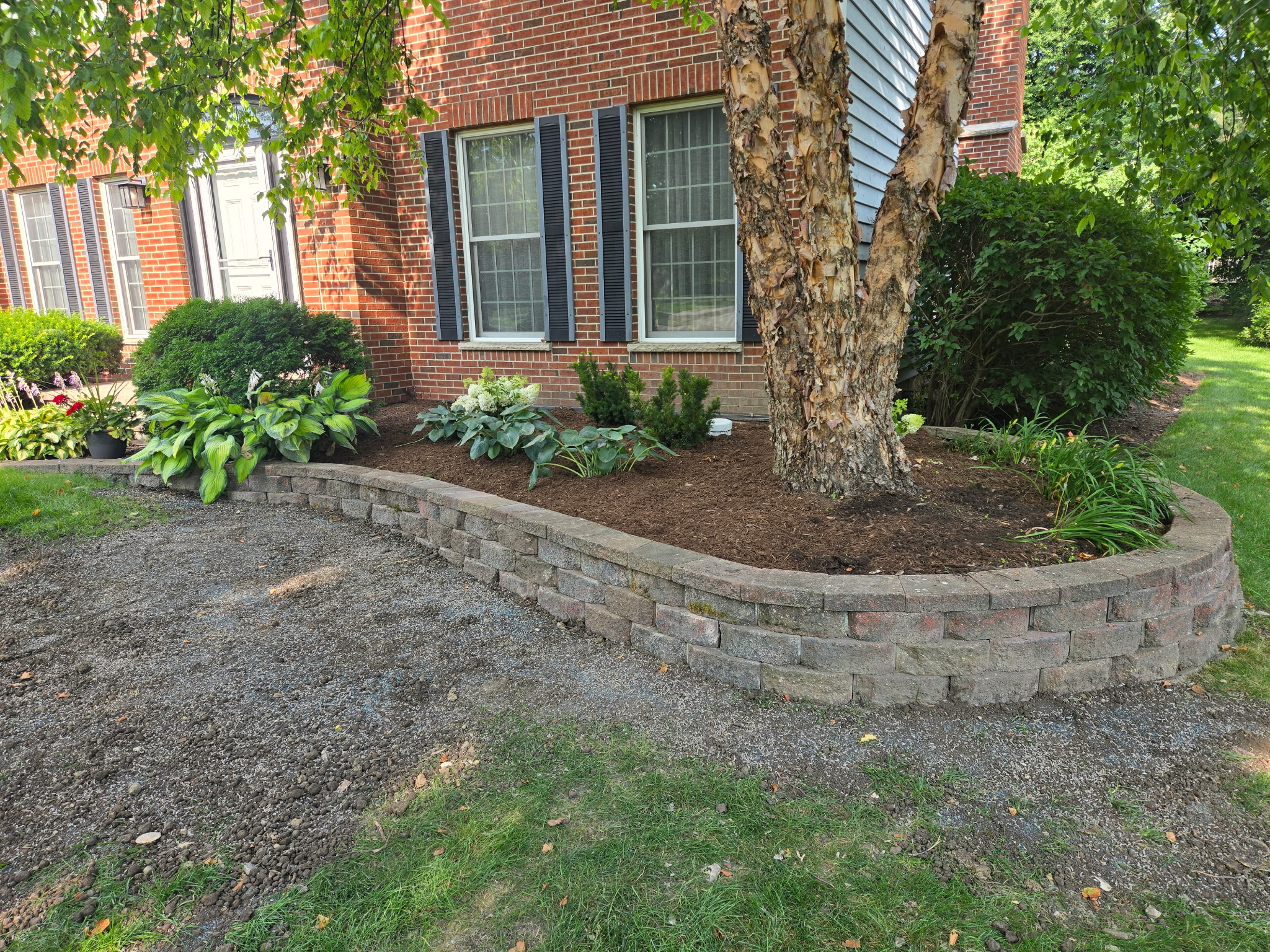 Retaining wall restoration after — B&L Landscape