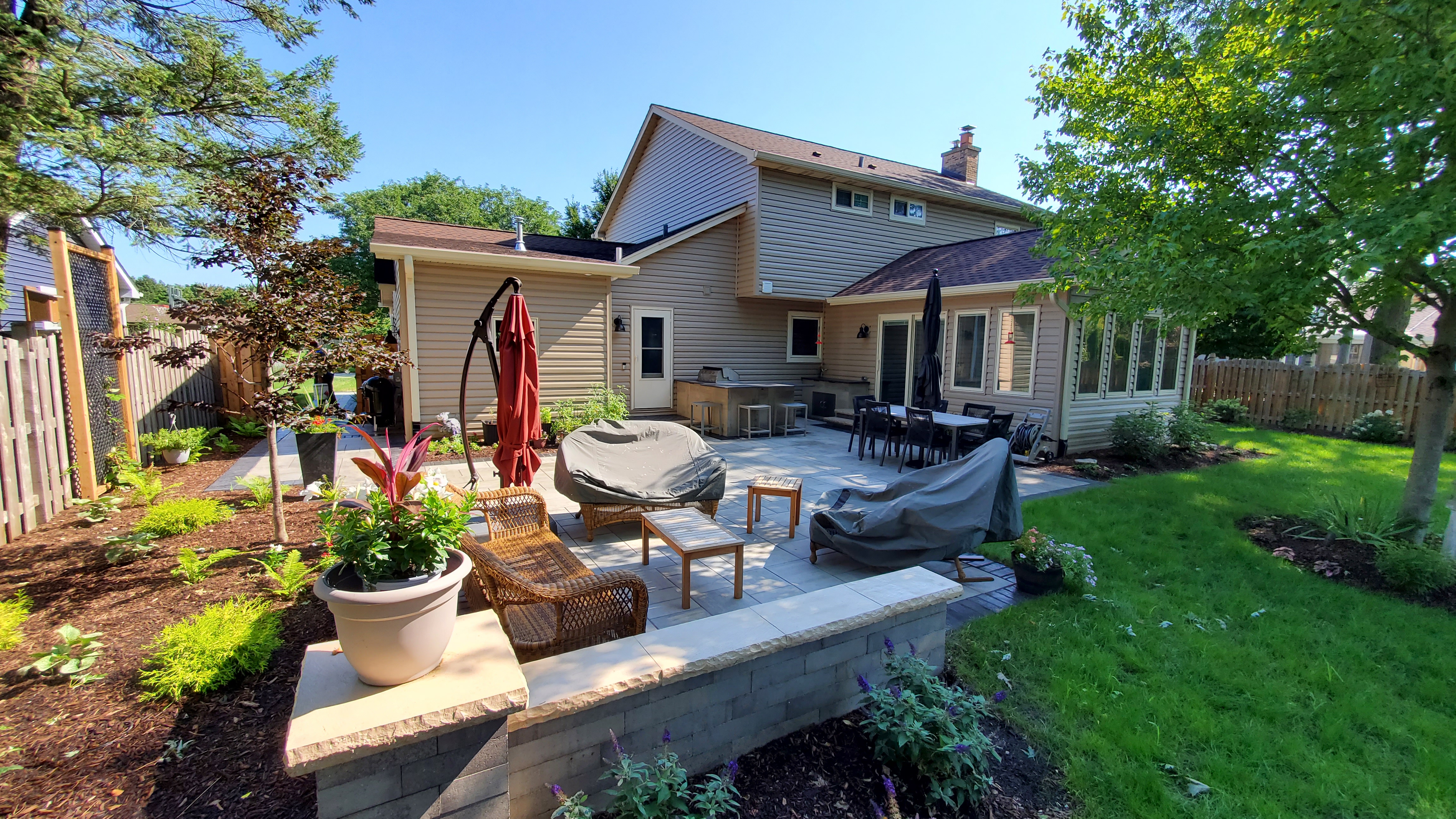 Paver patio with seat wall and outdoor kitchen, Batavia, IL — B&L Landscape
