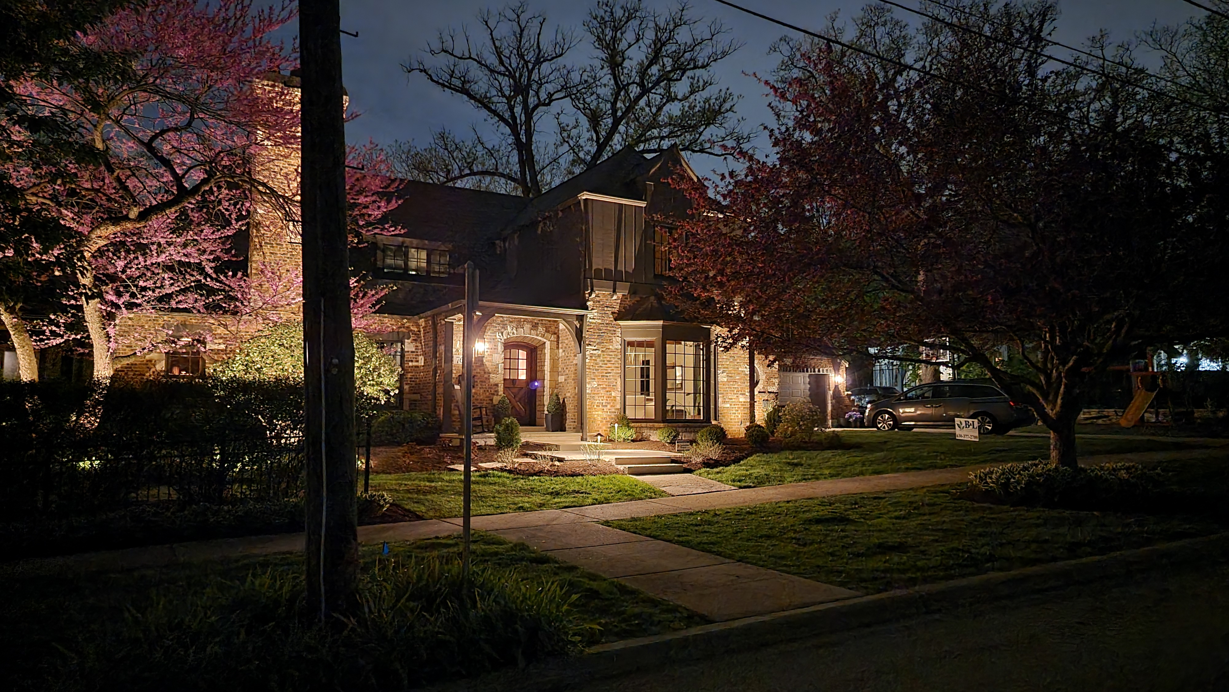 Brick house at night with landscape lights, Glen Ellyn, IL — B&L Landscape