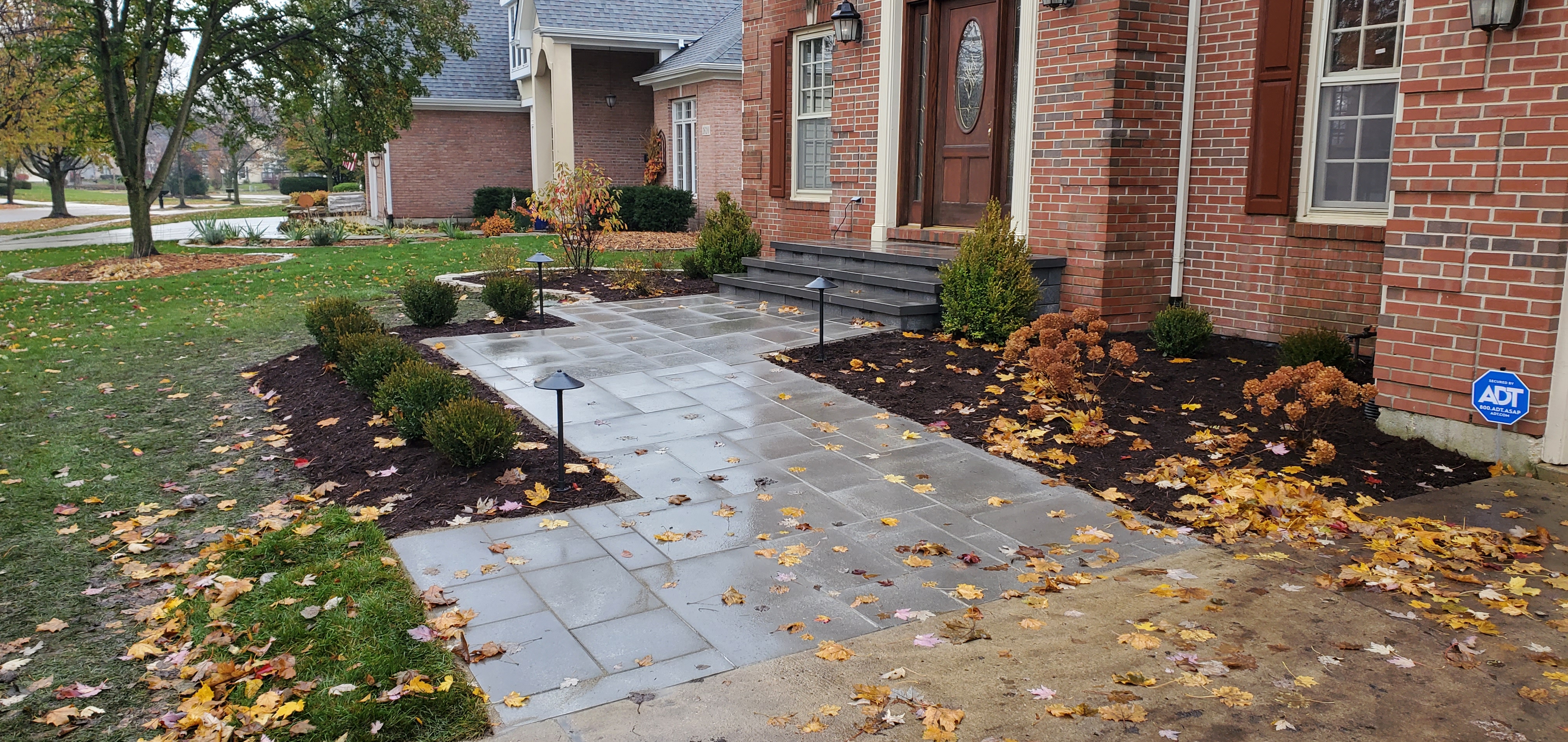Front walkway with large front stoop, new landscaping and landscape lights, St. Charles, IL — B&L Landscape