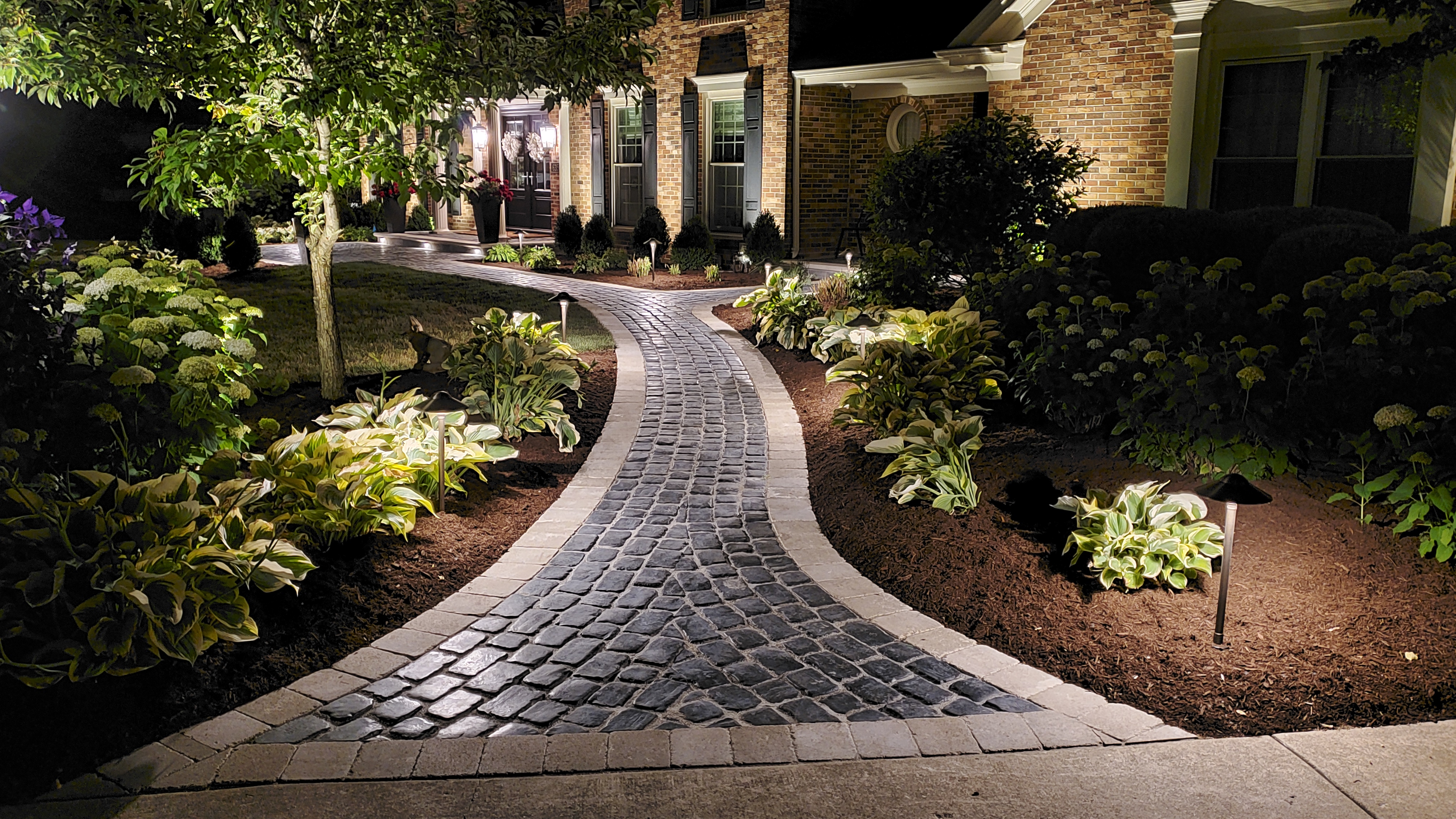 Front walkway at night with landscape lights, St. Charles, IL — B&L Landscape
