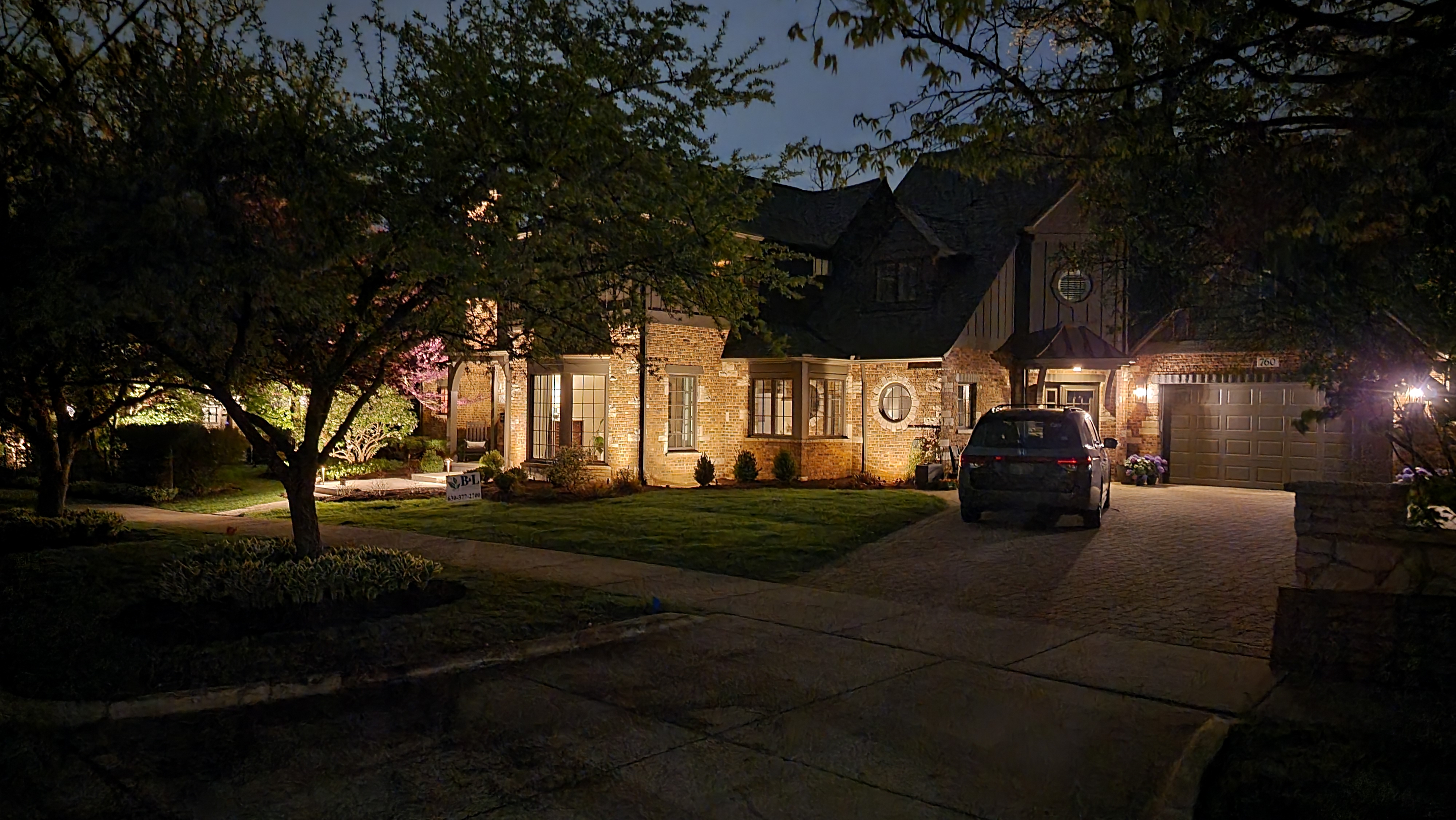 House with landscape lights at night, Glen Ellyn, IL — B&L Landscape